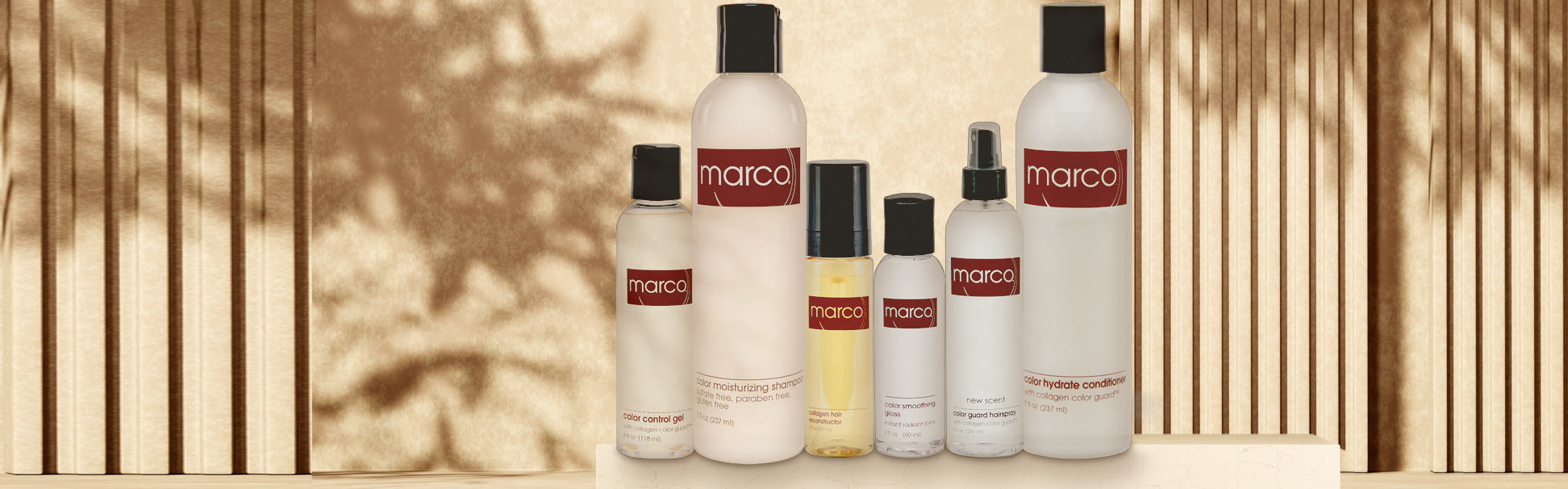 Marco® Collagen Color Guard® haircare and styling products line up against a golden sun lit wall